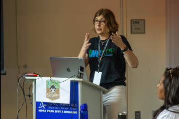 Speaker at a podium with audience